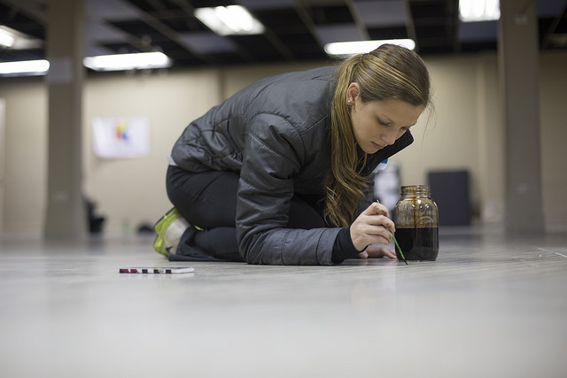 Girl painting floor at Kaliedoscope